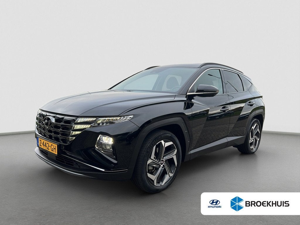 Hyundai Tucson 1.6 T-GDI 265pk PHEV Premium 4WD, Gebruikt, 4 cilinders, Zwart, Bedrijf