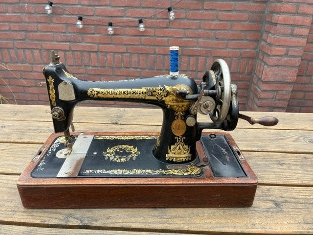 antieke Singer naaimachine, Ophalen