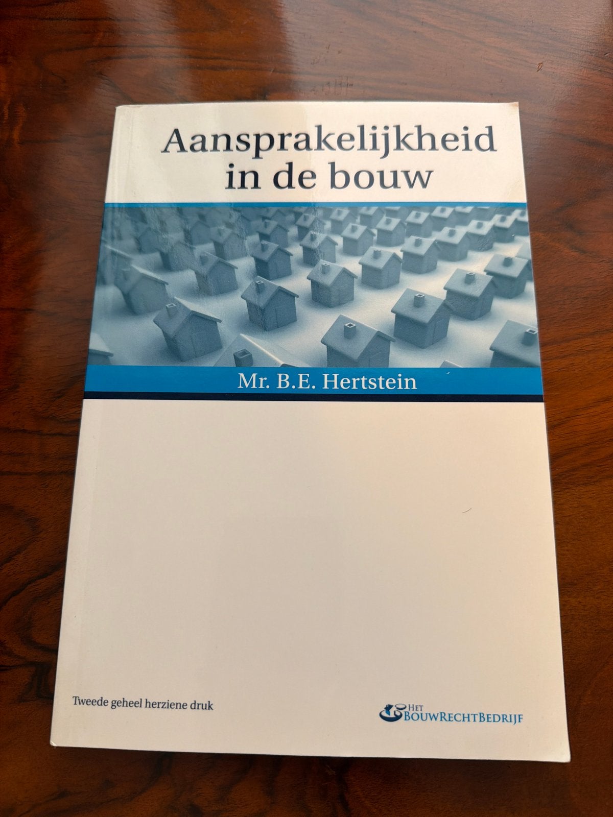 Aansprakelijkheid in de bouw - Mr. B.E. Hertstein, Boeken, Ophalen of Verzenden, Gamma, Zo goed als nieuw, HBO