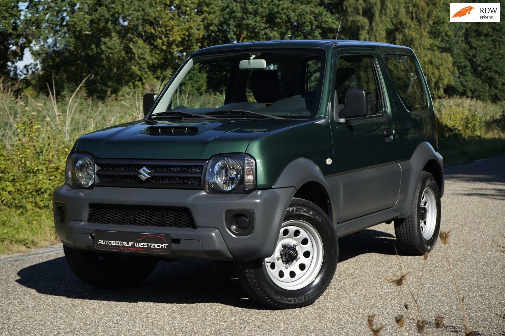 Suzuki Jimny 1.3 Ranger 4WD, Trekhaak, 2 eigenaren!, Auto's, Metallic lak, Gebruikt, Zwart, 4 stoelen