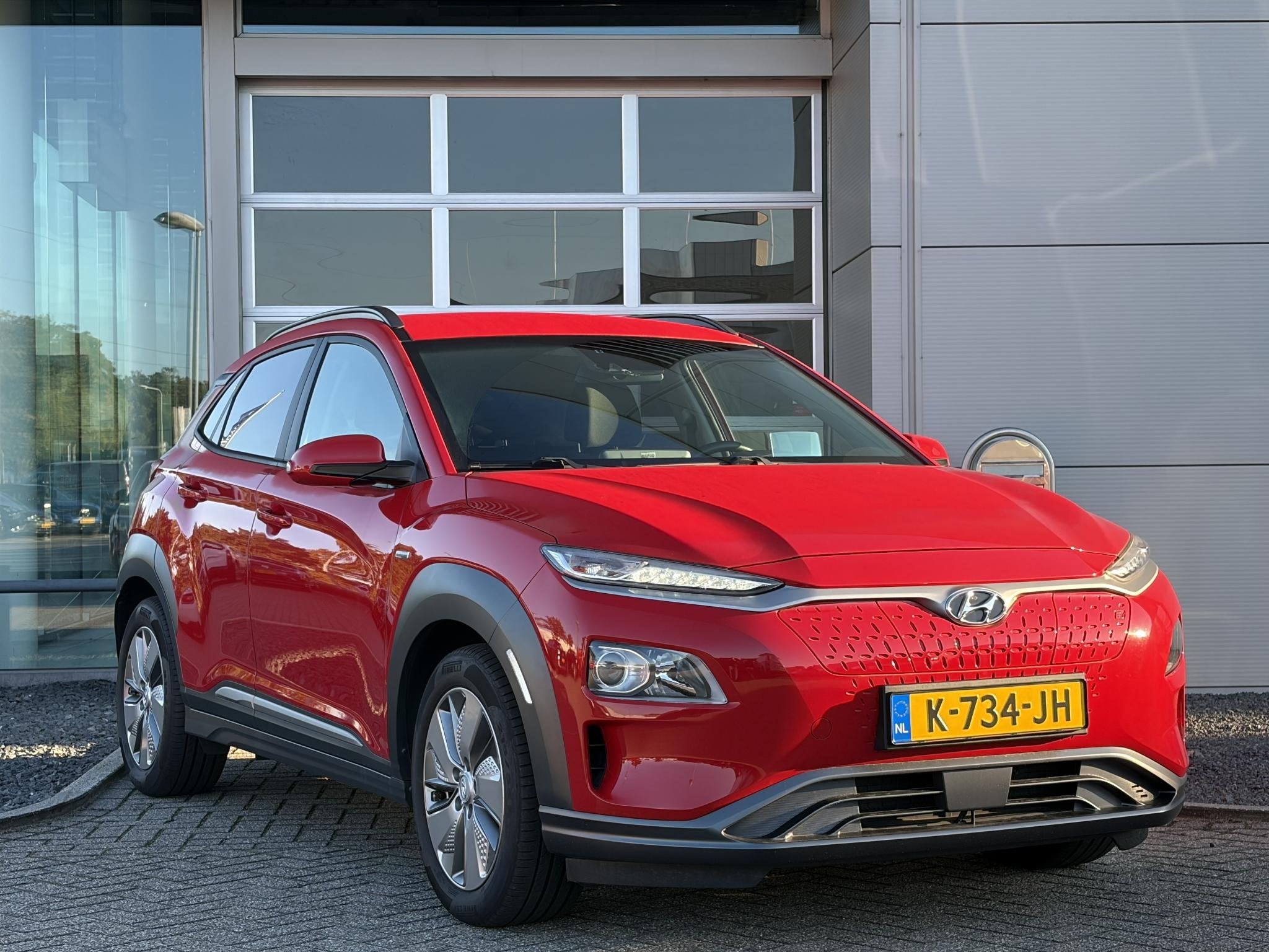 Hyundai Kona EV Fashion 64 kWh I SOH 96.2% I Navigatie i Ach, Stof, Gebruikt, Verwarmde buitenspiegels, Origineel Nederlands
