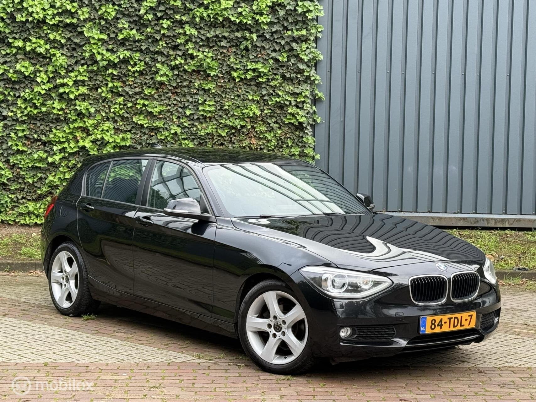BMW 1-serie 116i Business+ |Cruise|Trekhaak|Xenon/Led|Clima, 1-Serie, Euro 5, Gebruikt, Zwart