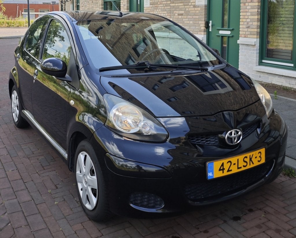 Toyota Aygo 1.0 12V Comfort Cool | NAP | Airco | Nieuwe APK!, Auto's, Voorwielaandrijving, Stof, Zwart, 4 stoelen