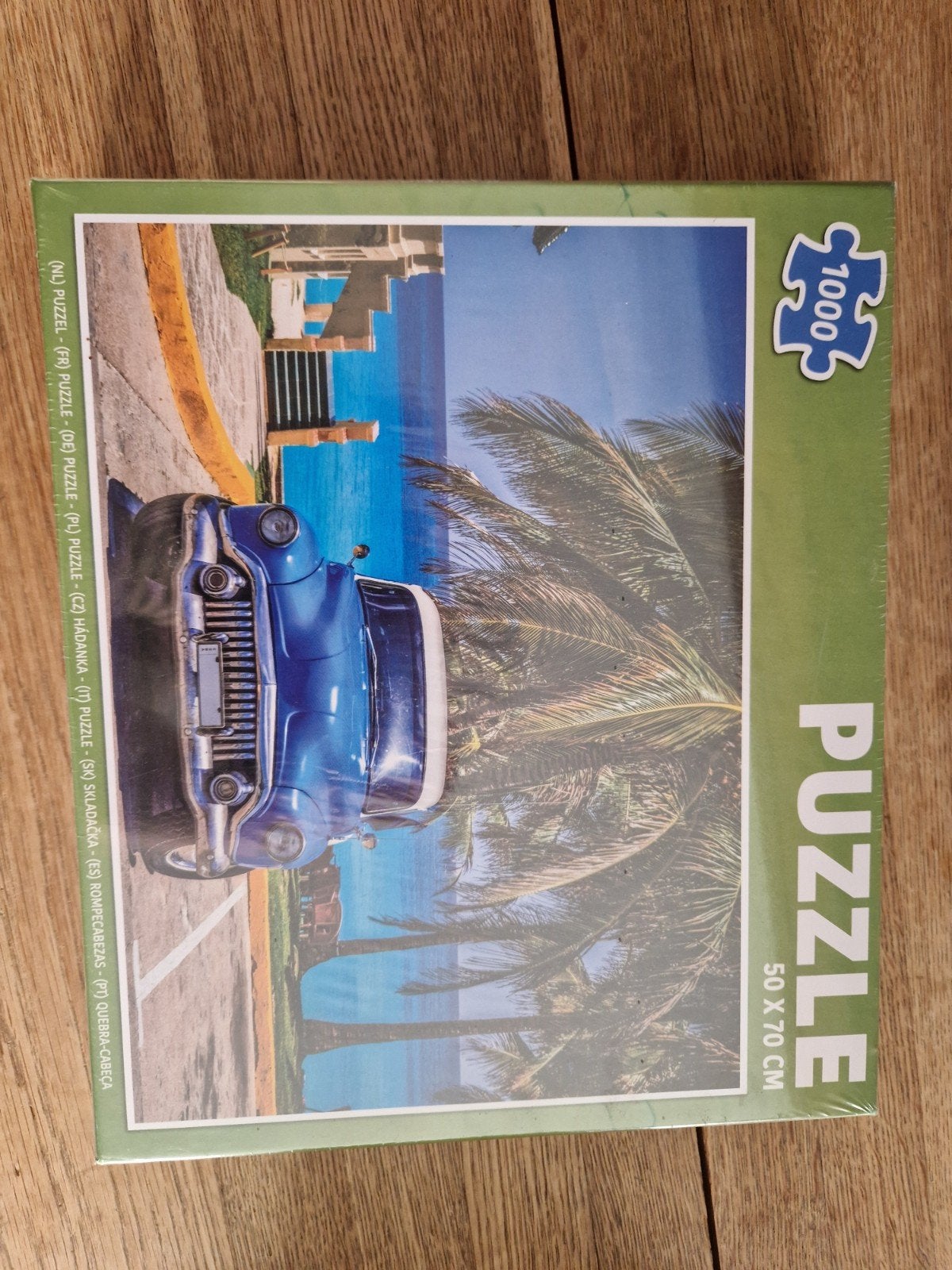 Puzzel 1000 stukjes: Blauwe auto aan zee, Kinderen en Baby's, Speelgoed | Kinderpuzzels, Ophalen of Verzenden