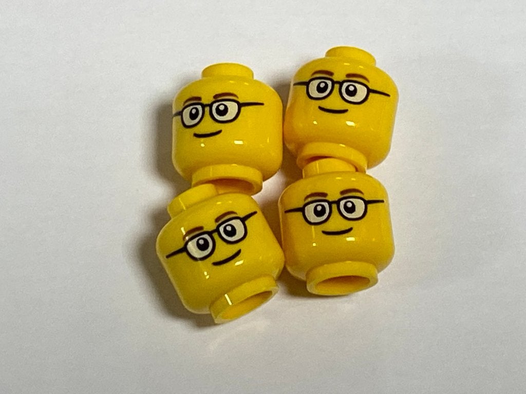 Partij Lego 4x nieuwe geel hoofd met bril en lach
