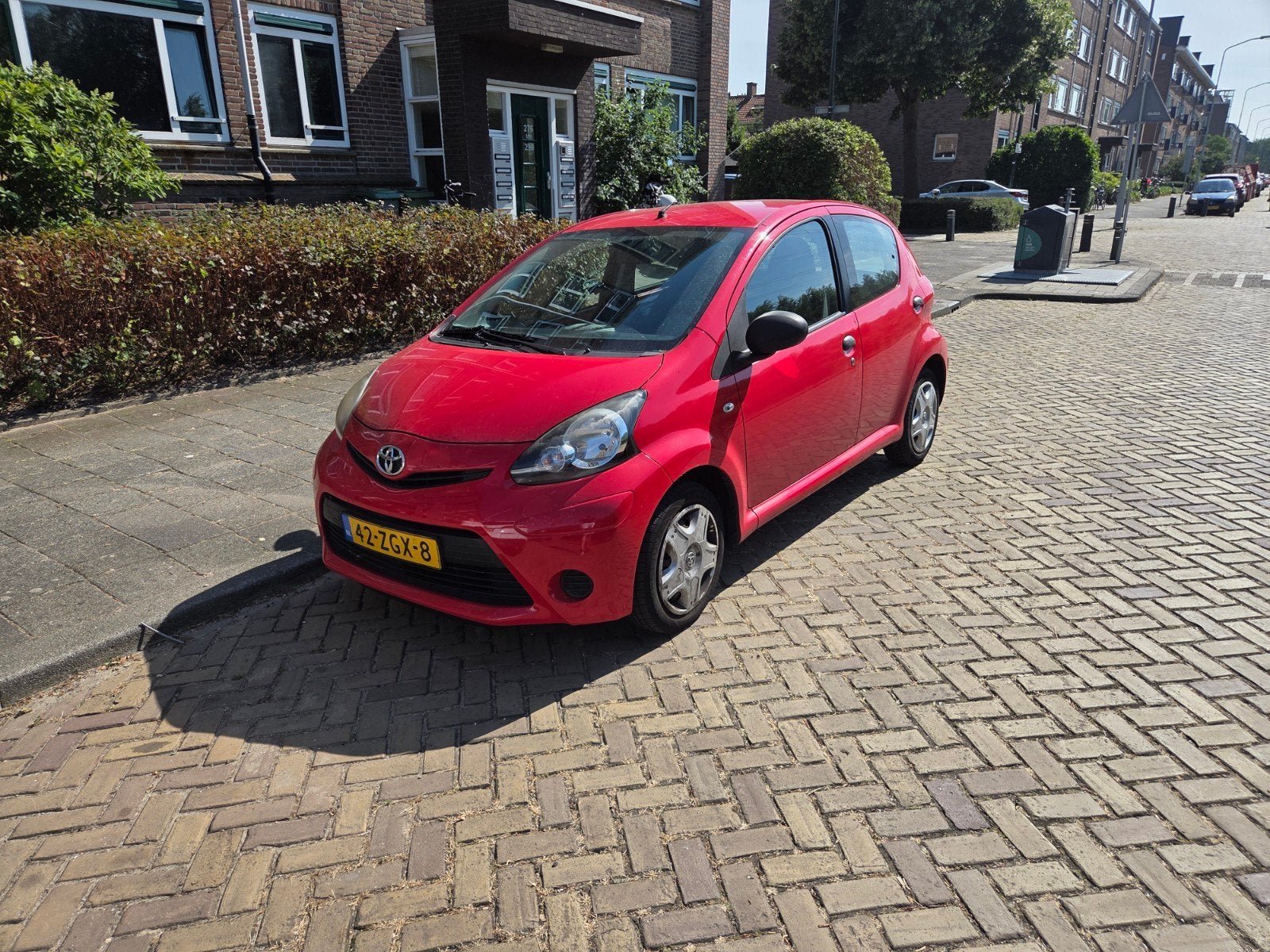 Toyota Aygo 1.0 12V Vvt-i 5DRS 2012 Rood, Voorwielaandrijving, 4 stoelen, Origineel Nederlands, Handgeschakeld