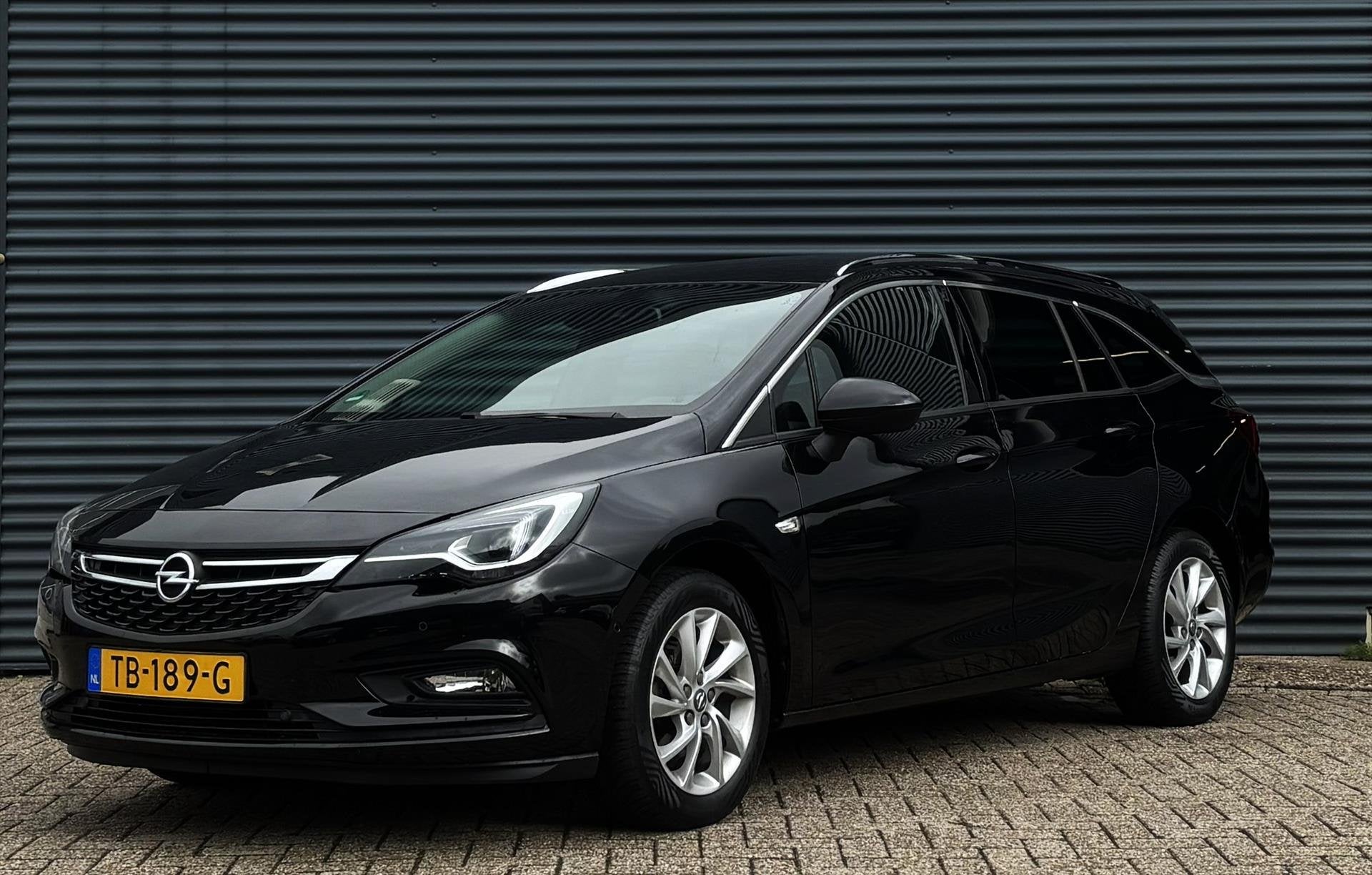 Opel Astra Sports Tourer 1.4 Turbo 150pk, Auto's, Parkeersensor, Gebruikt, Euro 6, 4 cilinders