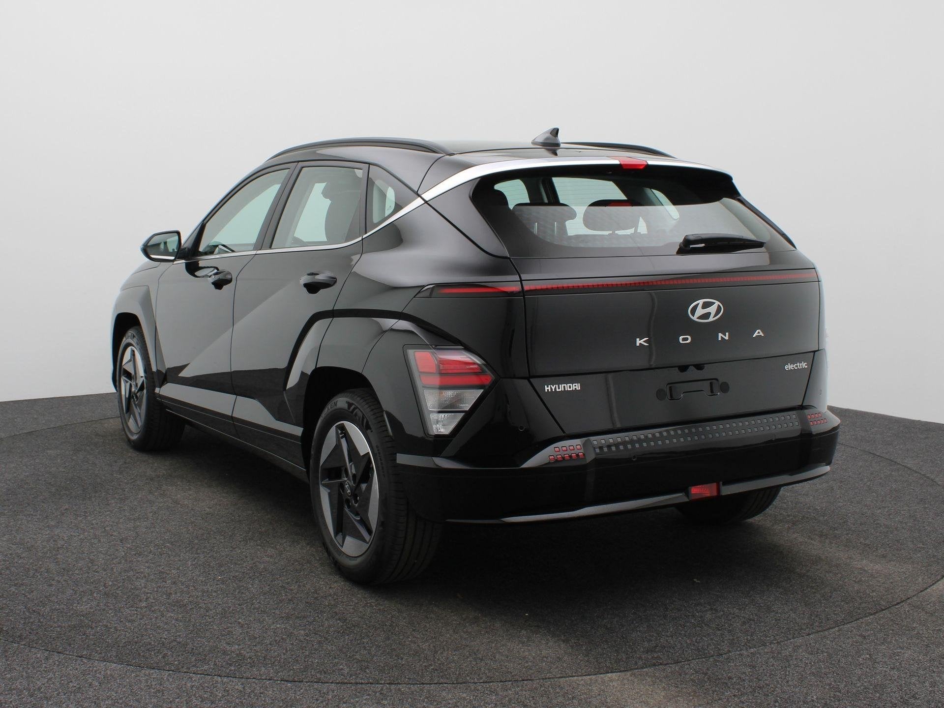 Hyundai Kona Electric Comfort 64.8 kWh | Navigatie | Achteru, Auto's, Stof, Zwart, Met garantie (alle), Zwart