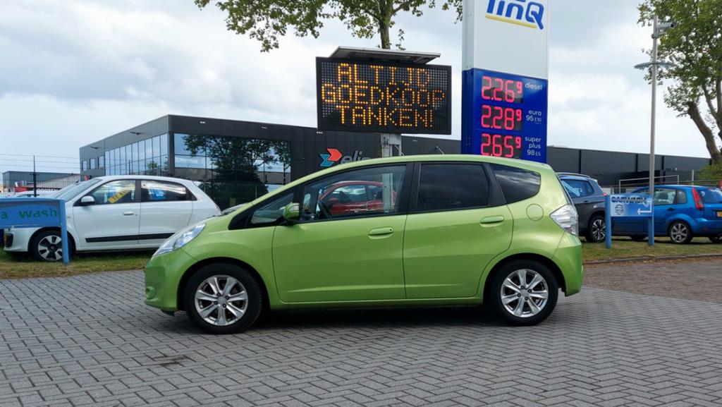 Honda Jazz Automaat 1.4 Hybrid Exclusive met Alle Opties., Auto's, Honda, Lichtsensor, Zwart, 4 cilinders, 49 €/maand
