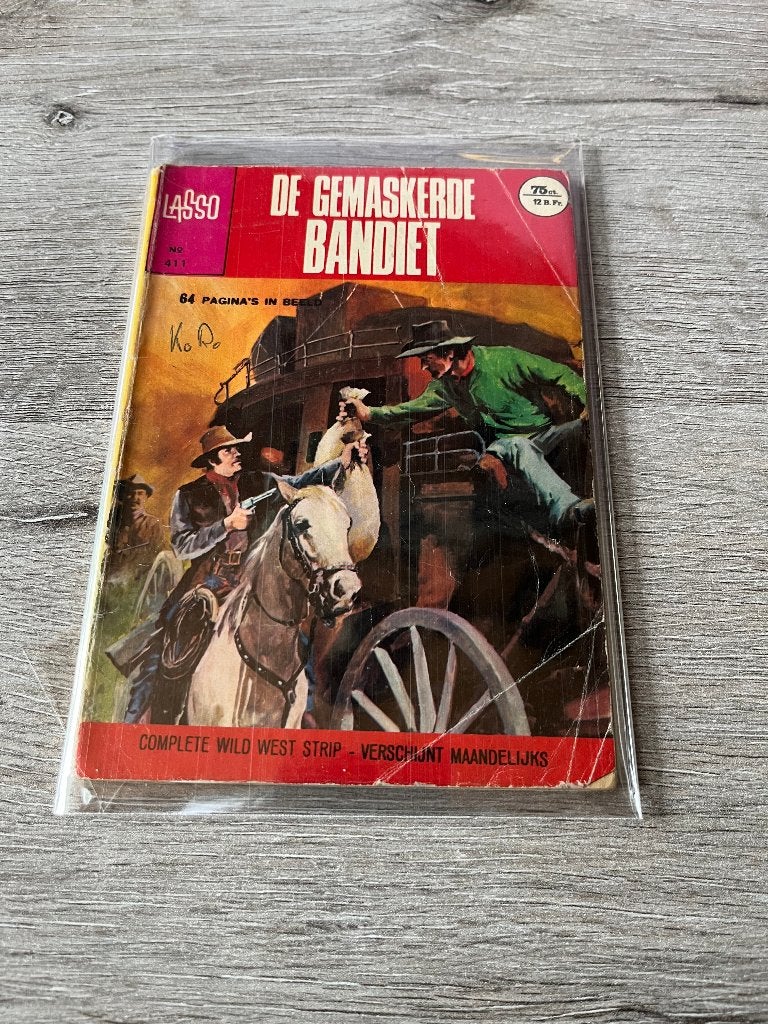 Lasso 411 De gemaskerde bandiet, Boeken, Eén stripboek, Ophalen of Verzenden, Gelezen