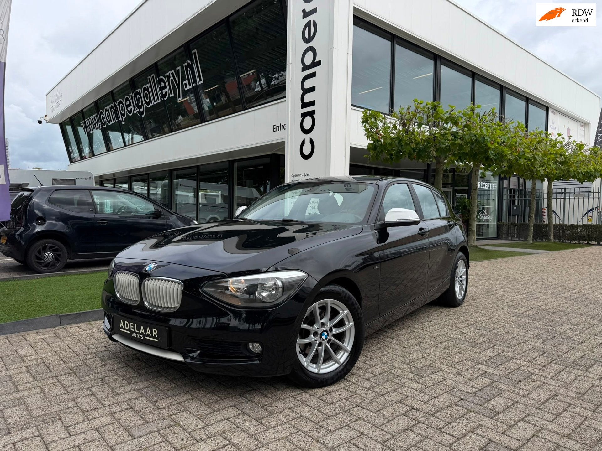 BMW 1-serie 116i l AIRCO l PDC l MULTISTUUR, 1-Serie, 4 cilinders, Cruise Control, Zwart