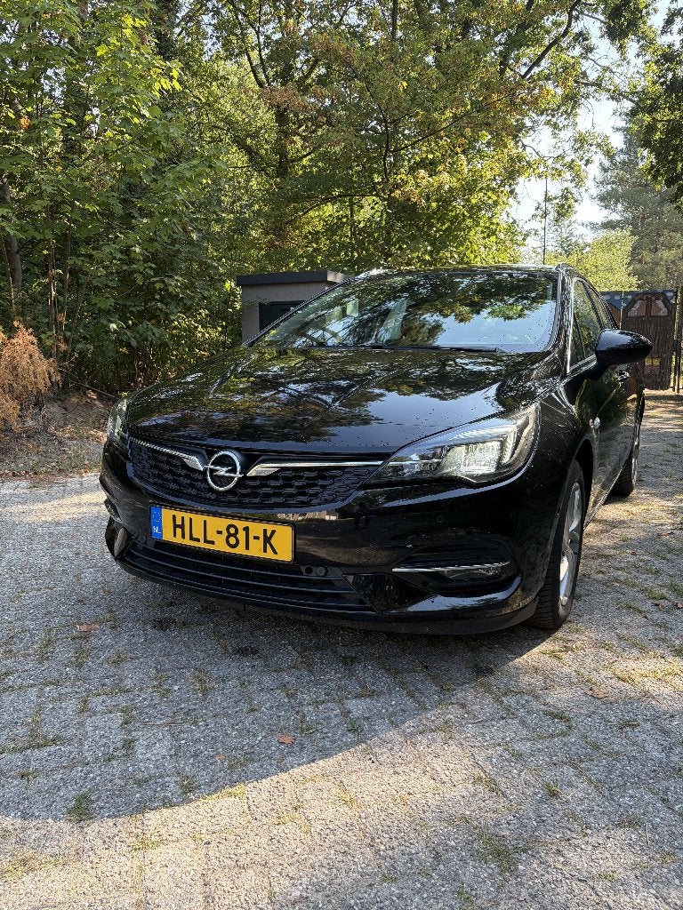 Opel Astra 1.2 Turbo 110pk 2021 Zwart weinig kilometers!!!, Voorwielaandrijving, 1199 cc, Leder en Stof, Zwart