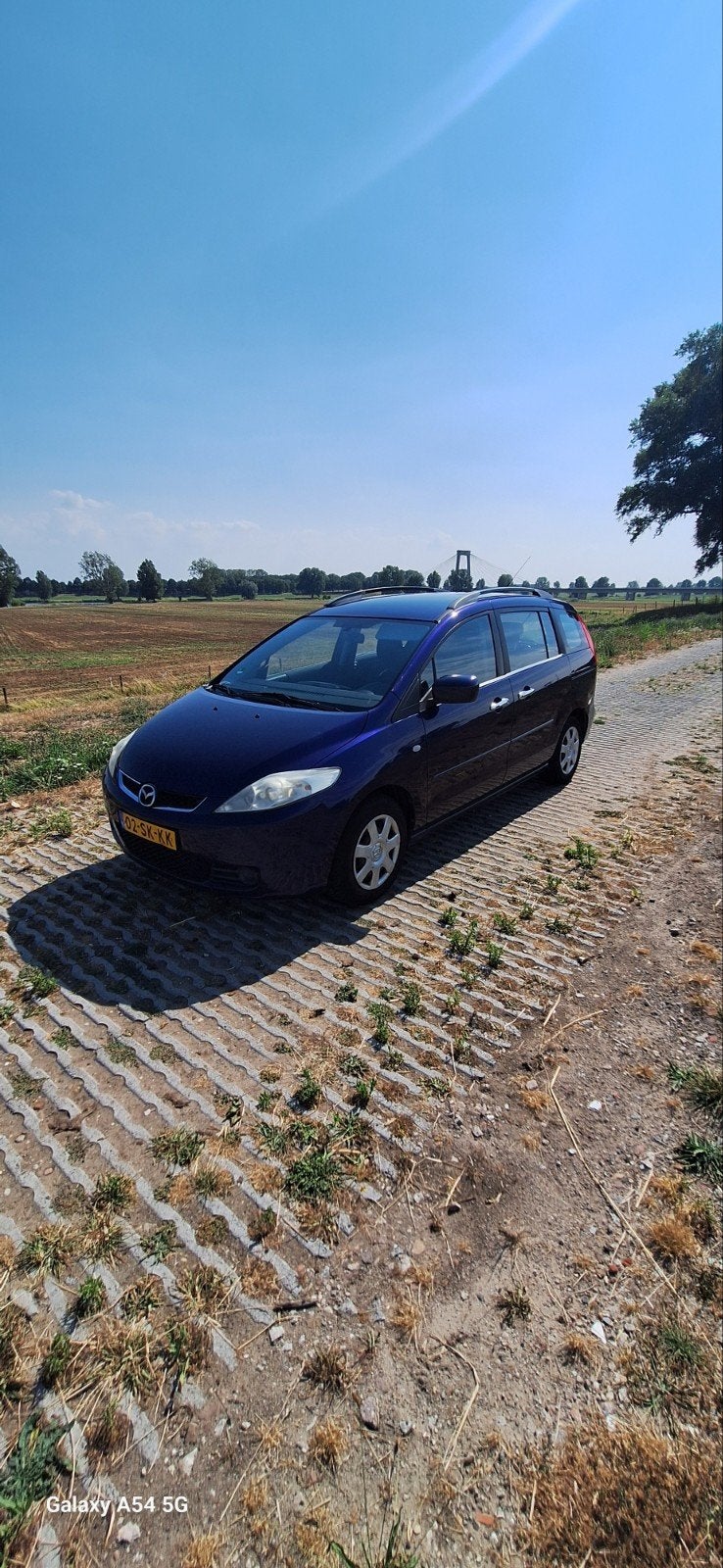 7 persoons auto Mazda 5 2.0 2006 Blauw, Ophalen