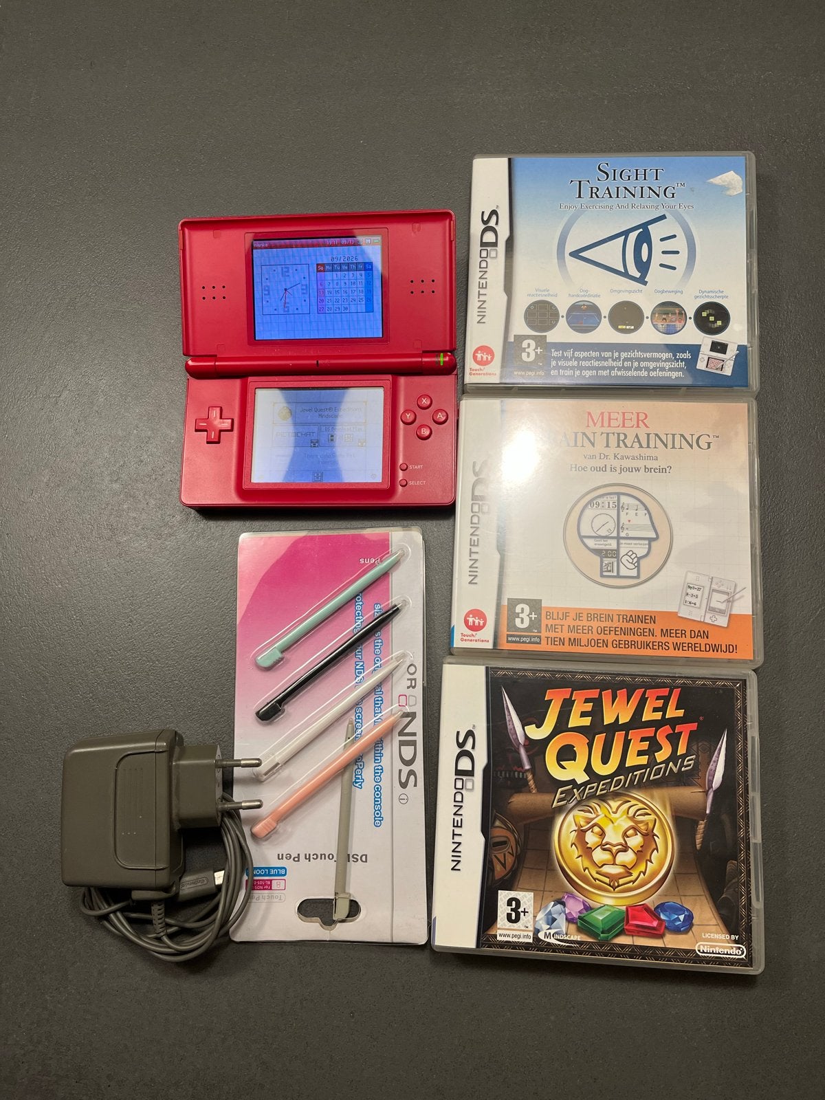 Rode Nintendo DS Lite met 3 spellen en accessoires, Spelcomputers en Games, Ophalen of Verzenden, Rood, DS Lite, Gebruikt