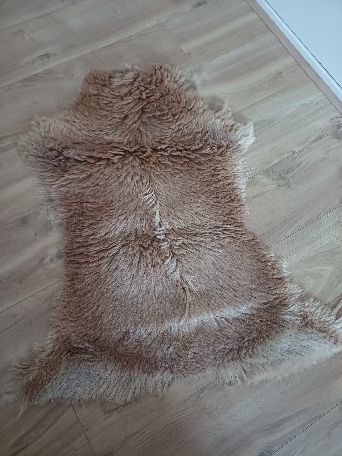 Leren vachtkleedje, Ophalen