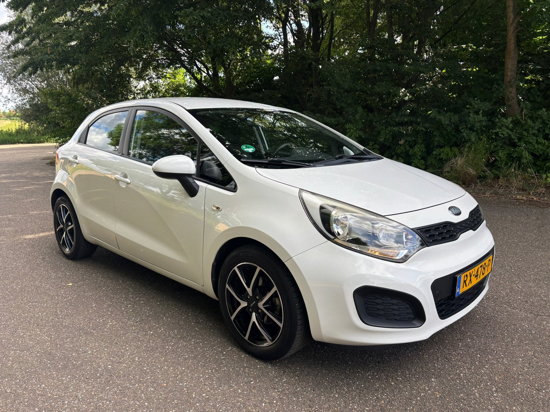 Kia Rio 1.2 CVVT Comfort Pack | Airco | 5-drs. | APK 12-2026, Voorwielaandrijving, Euro 5, Zwart, Wit