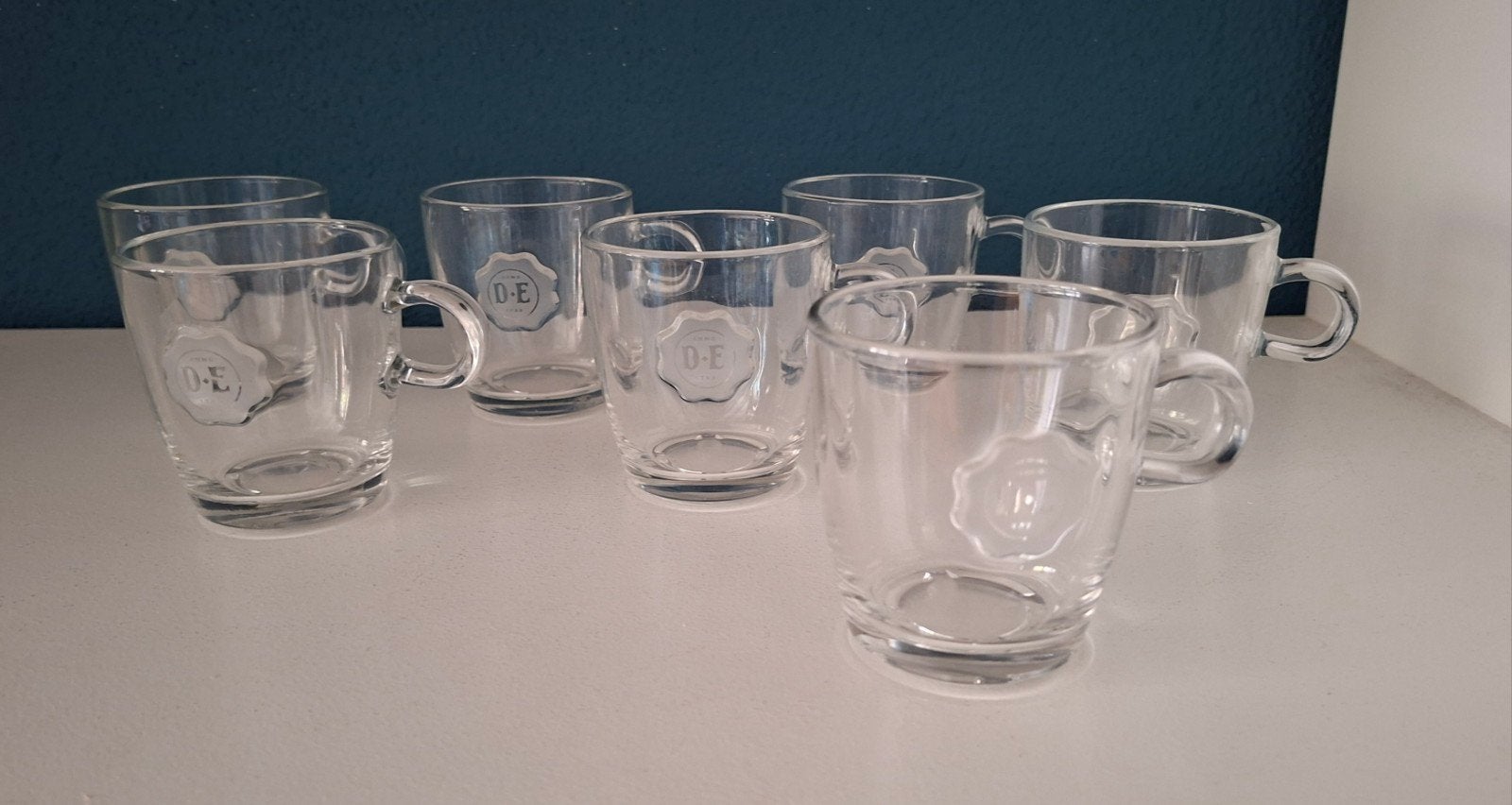 Zeven Douwe Egberts glazen senseo mokjes, Glas of Glazen, Ophalen of Verzenden, Overige stijlen, Glas