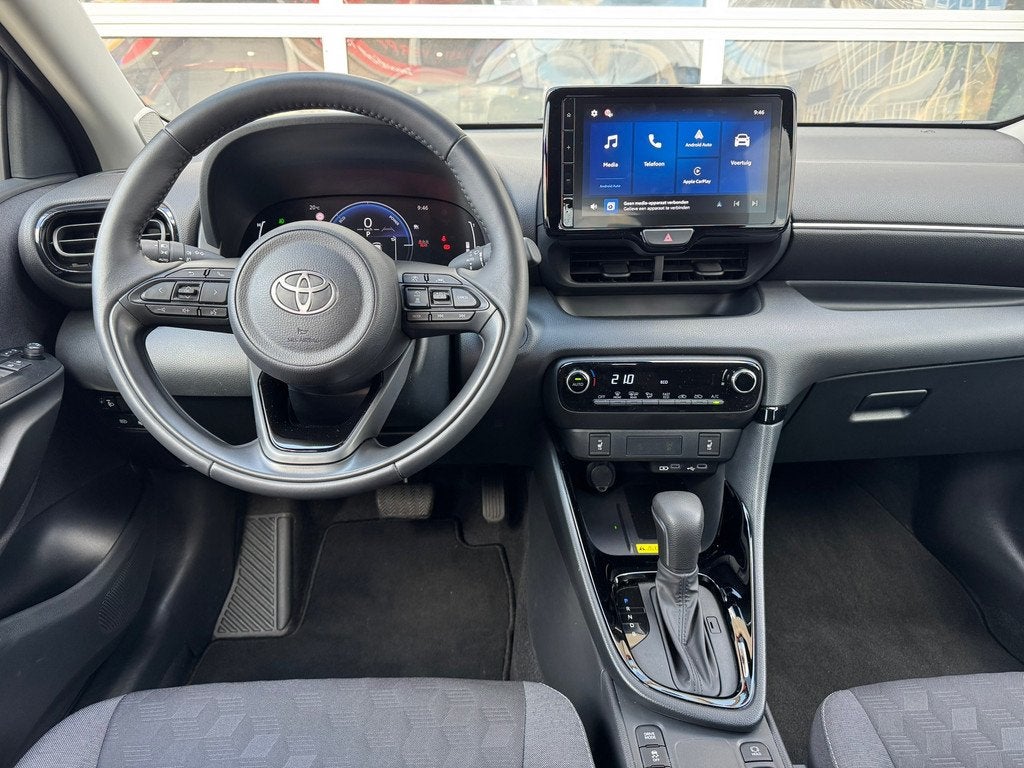 Toyota Yaris 1.5 Hybrid 115 Dynamic|Comfort Pack|Apple CarPl, 12 maanden, Stof, Gebruikt, Zwart