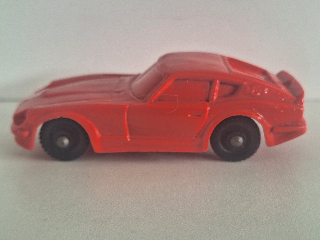 Datsun 240z No.28 Rood Tomte Laerdal 1/43, Ophalen of Verzenden, Gebruikt, Auto, Tomte