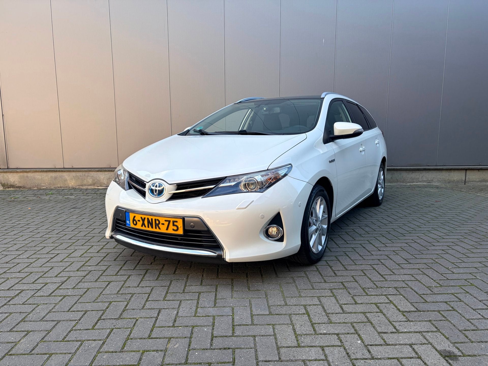 Toyota Auris Touring Sports 1.8 Hybrid Lease+, Auto's, Stof, Gebruikt, Zwart, Wit