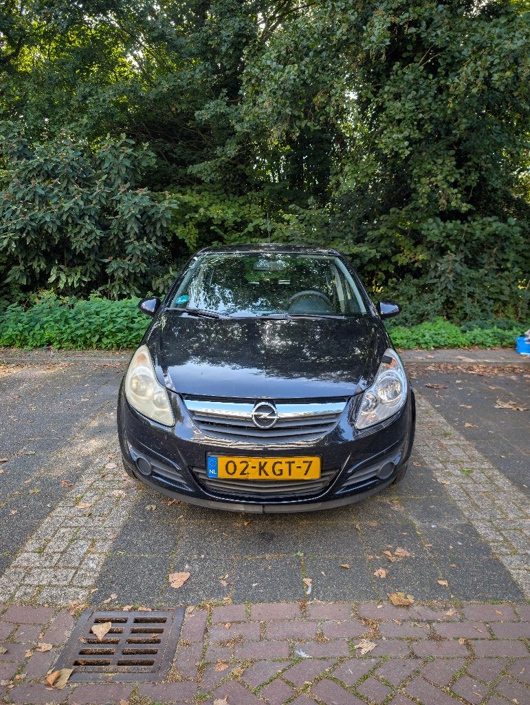 Opel Corsa 1.2 16V 5D 2009 Zwart, Auto's, Voorwielaandrijving, USB, Stof, Zwart