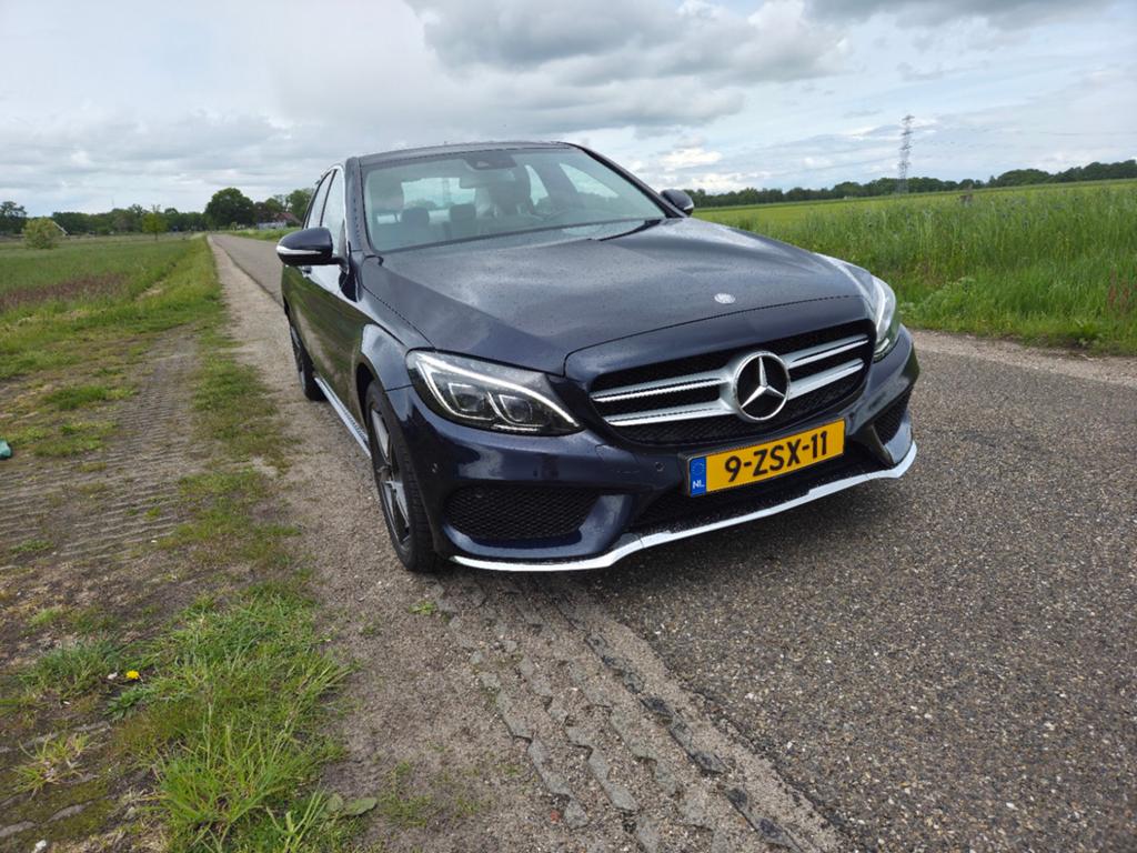 Mercedes-Benz C-Klasse AMGpak C180 1.6 115KW Aut7 2015 Blauw, Auto's, Mercedes-Benz, Automaat, 1800 kg, Blauw, Particulier