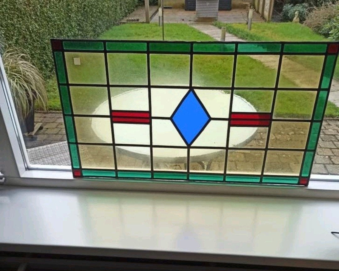 Mooi glas in lood raam, Ophalen