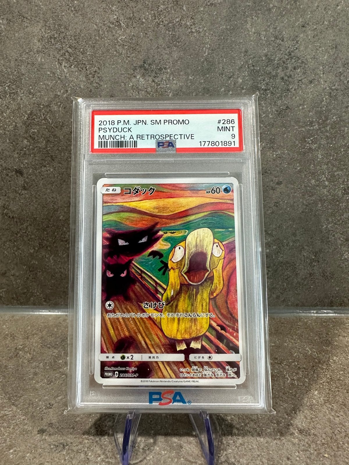 Psyduck Munch PSA 9, Ophalen of Verzenden, Zo goed als nieuw, Losse kaart