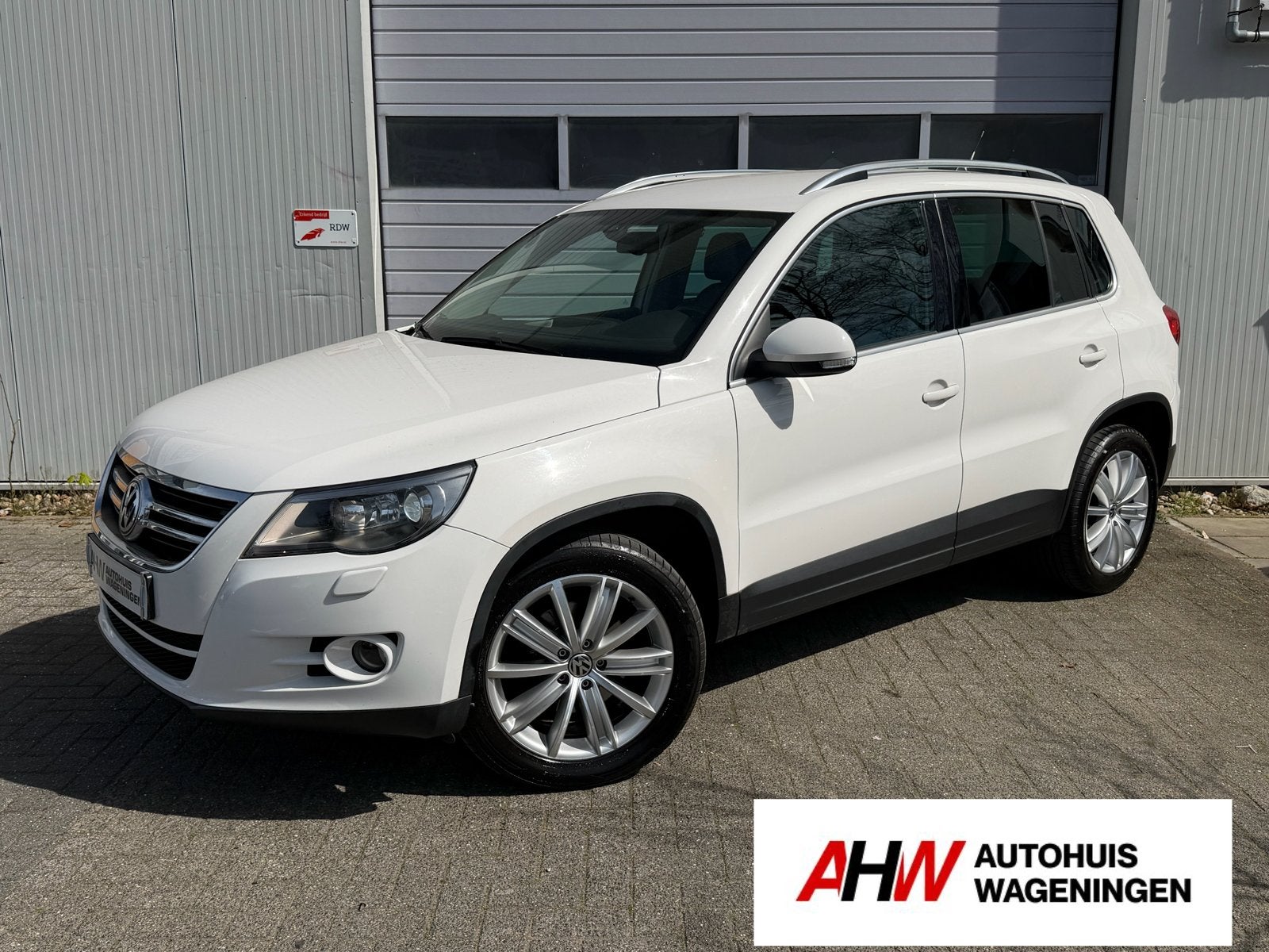 Volkswagen Tiguan / 2.0 TSI / 4MOTION / DYNAUDIO / LEER /, Auto's, Automaat, 4 cilinders, 1984 cc, Wit