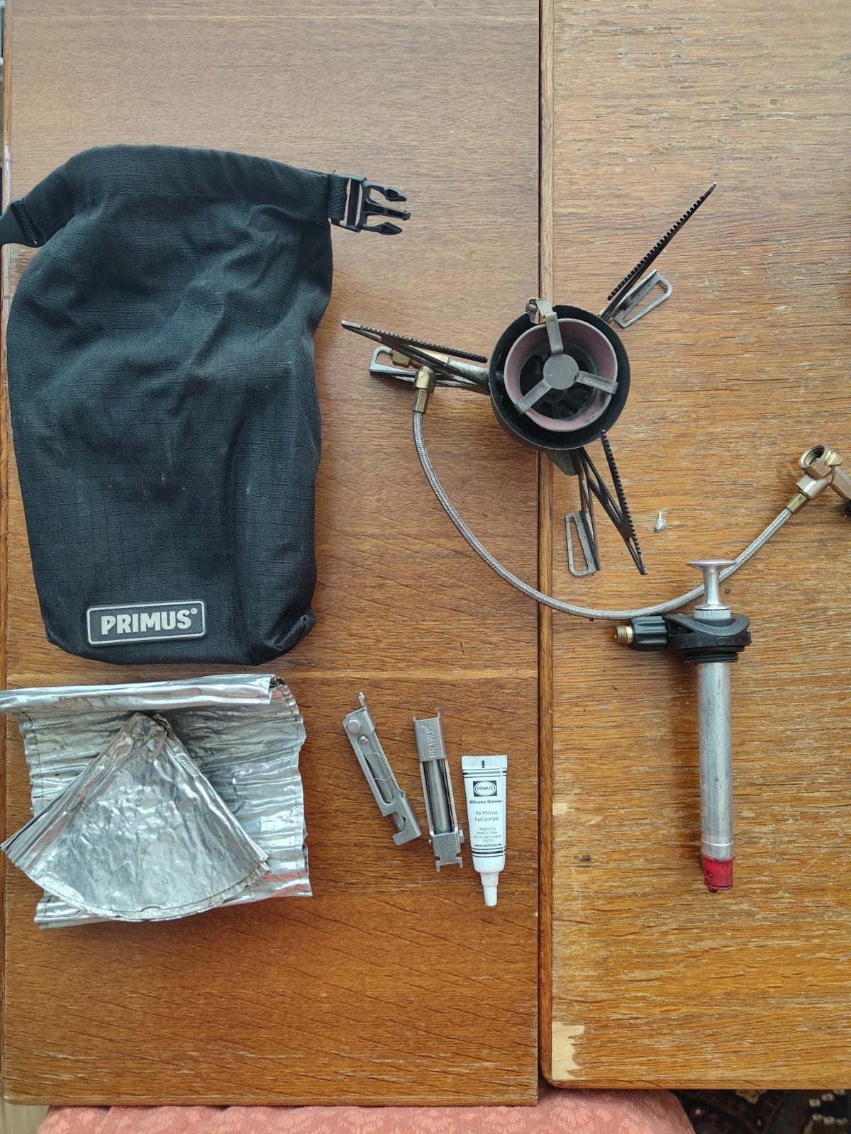 Primus multifuel brander met accessoires - gebruikt, Caravans en Kamperen, Ophalen of Verzenden