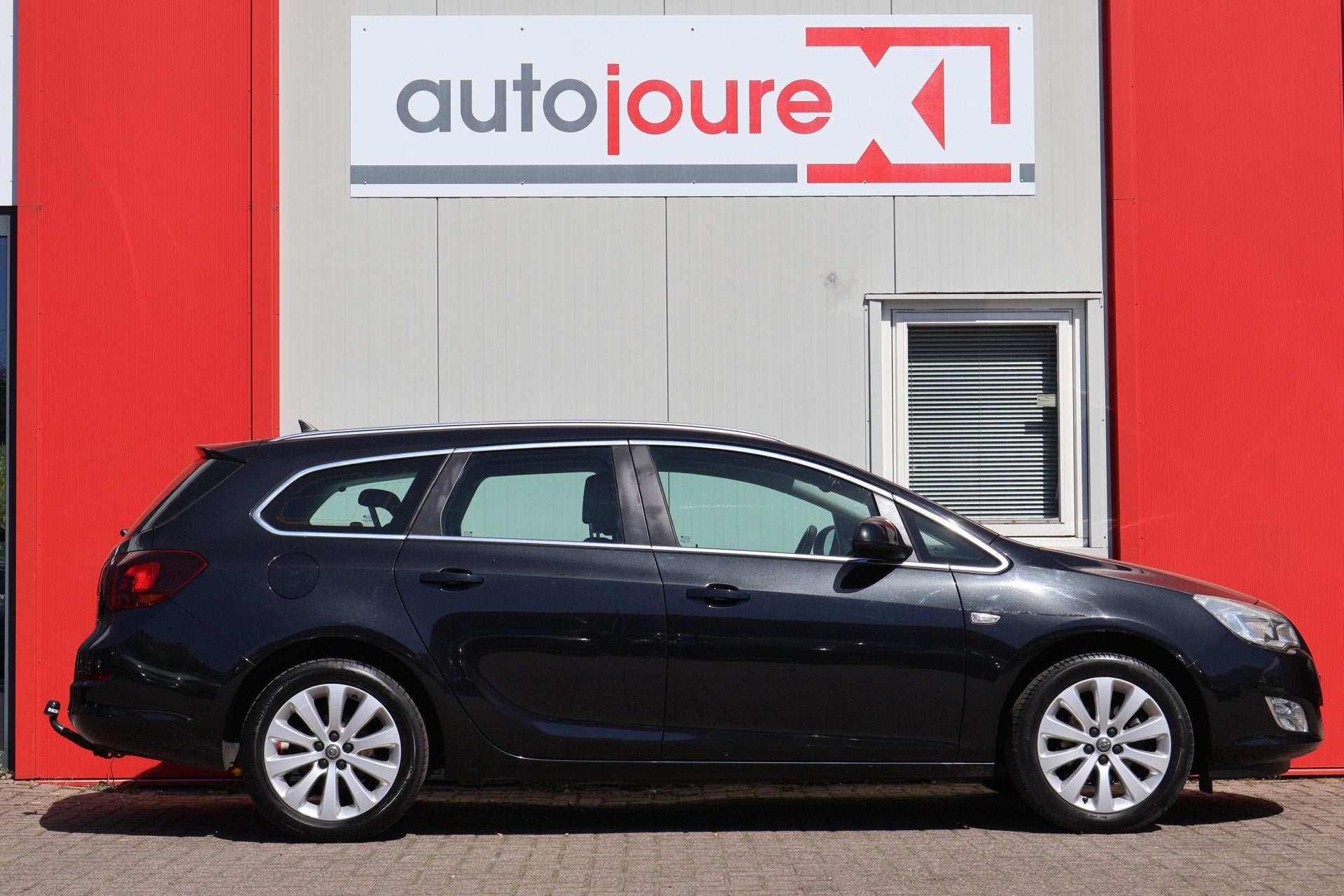 Opel Astra Sports Tourer 1.4 Turbo Cosmo (bj 2012), Auto's, Voorwielaandrijving, Euro 5, Gebruikt, Zwart