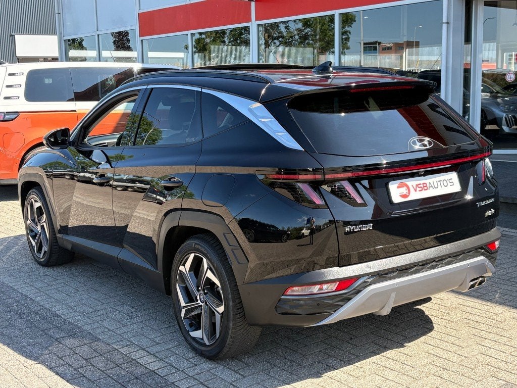 Hyundai TUCSON 1.6 T-GDI AUT. PHEV 4WD 265PK PANO-DAK LEER N, Auto's, Automaat, USB, Gebruikt, Huisgarantie
