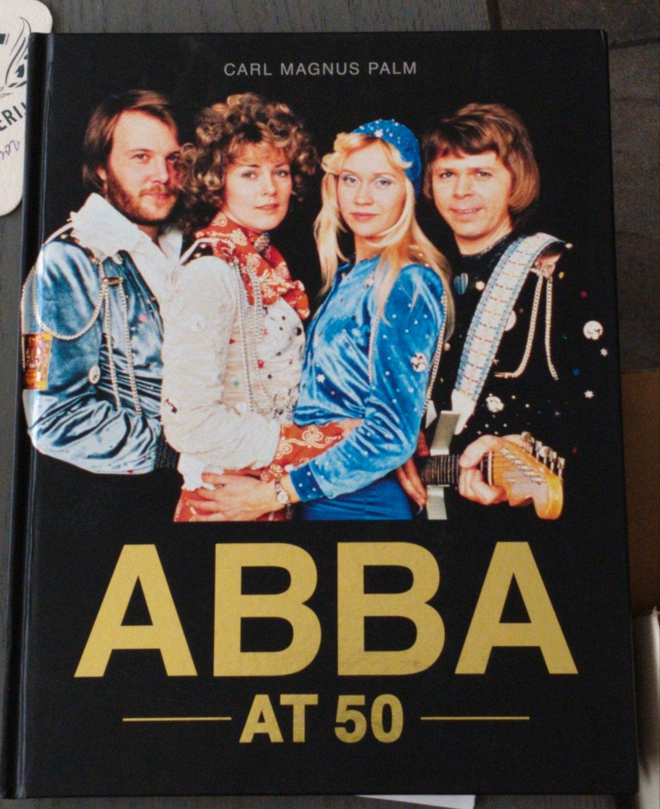 ABBA AT 50 - Carl Magnus Palm Boek, Boeken, Muziek, Zo goed als nieuw, Artiest, Ophalen of Verzenden