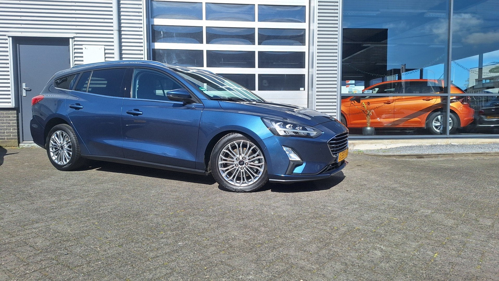 Ford Focus Wagon 1.5 EcoBoost Titanium Business Nav*Camera/C, Dealer onderhouden, Gebruikt, Euro 6, Blauw