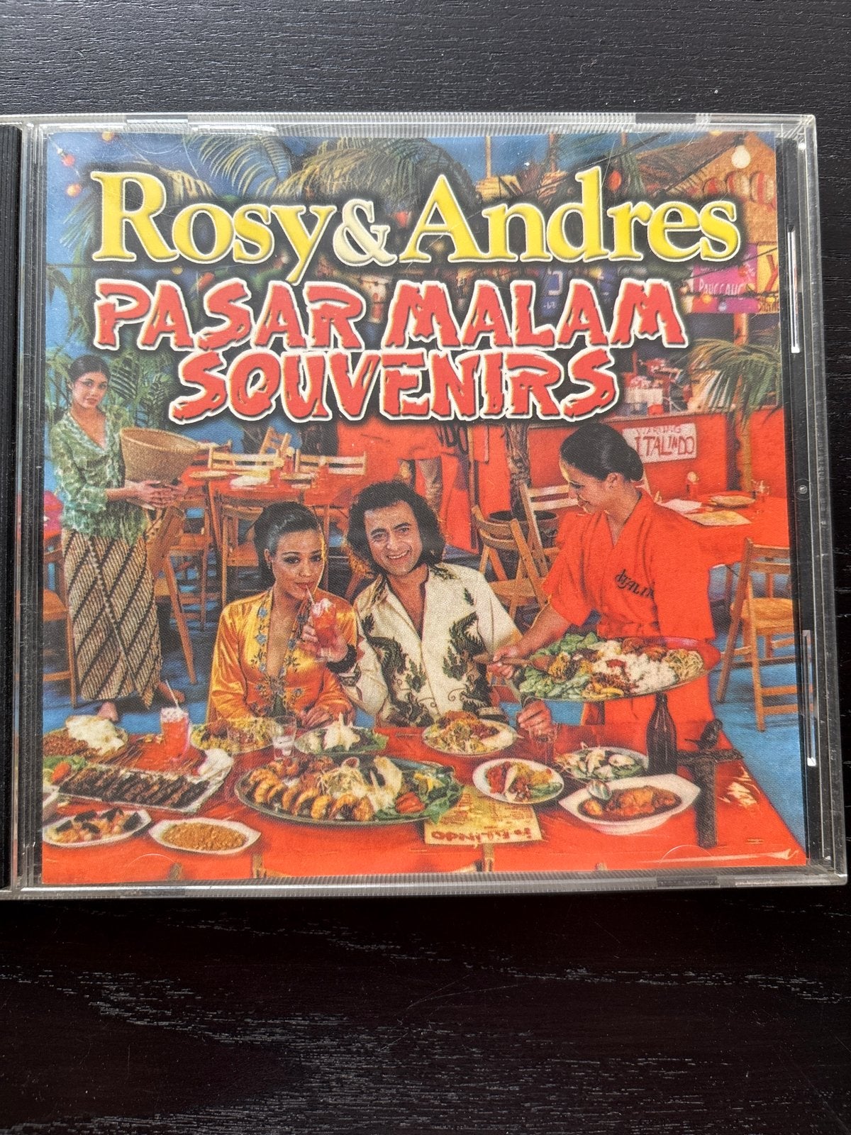 Rosy & Andres - Pasar Malam Souvenirs CD, Gebruikt, Overige genres, Ophalen of Verzenden, Inclusief boekje