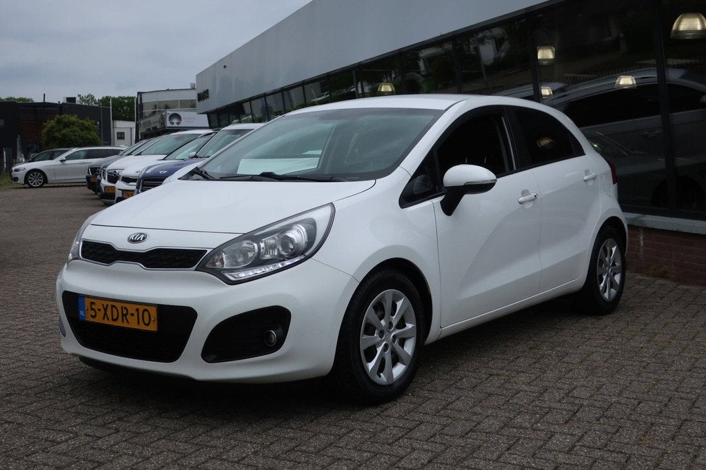Kia Rio 1.2 CVVT Super Pack 2e EIG_LED_CRUIS_KEYLESS_PDC_CLI, Zwart, 4 cilinders, Wit, Origineel Nederlands
