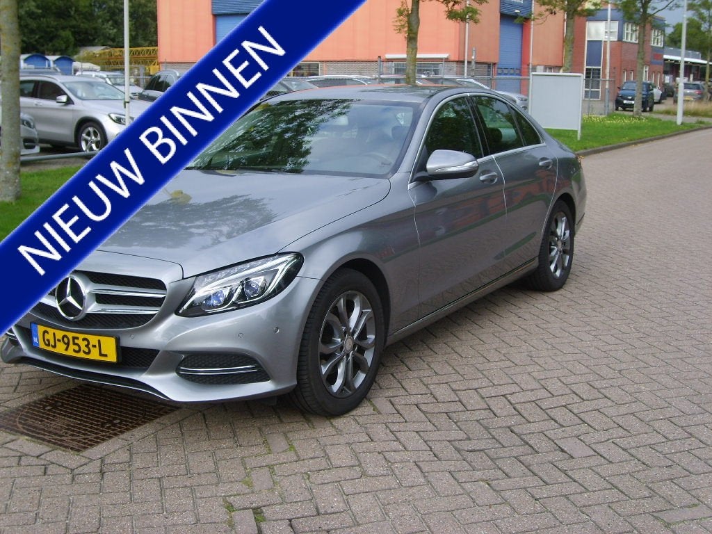 Mercedes-Benz C-Klasse 180 Ambition Automaat (bj 2015), Leder en Stof, Bedrijf, Grijs, Sedan