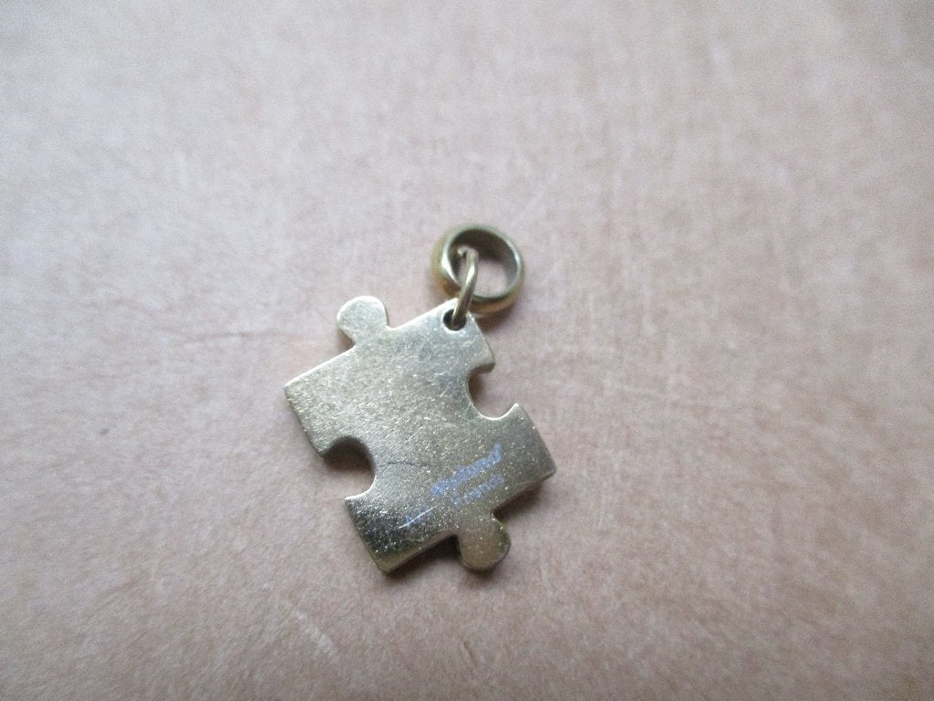 Goudkleur MELANO Puzzelstukje hanger Melano Friends, Verzenden, Zo goed als nieuw, Goud, Overige materialen
