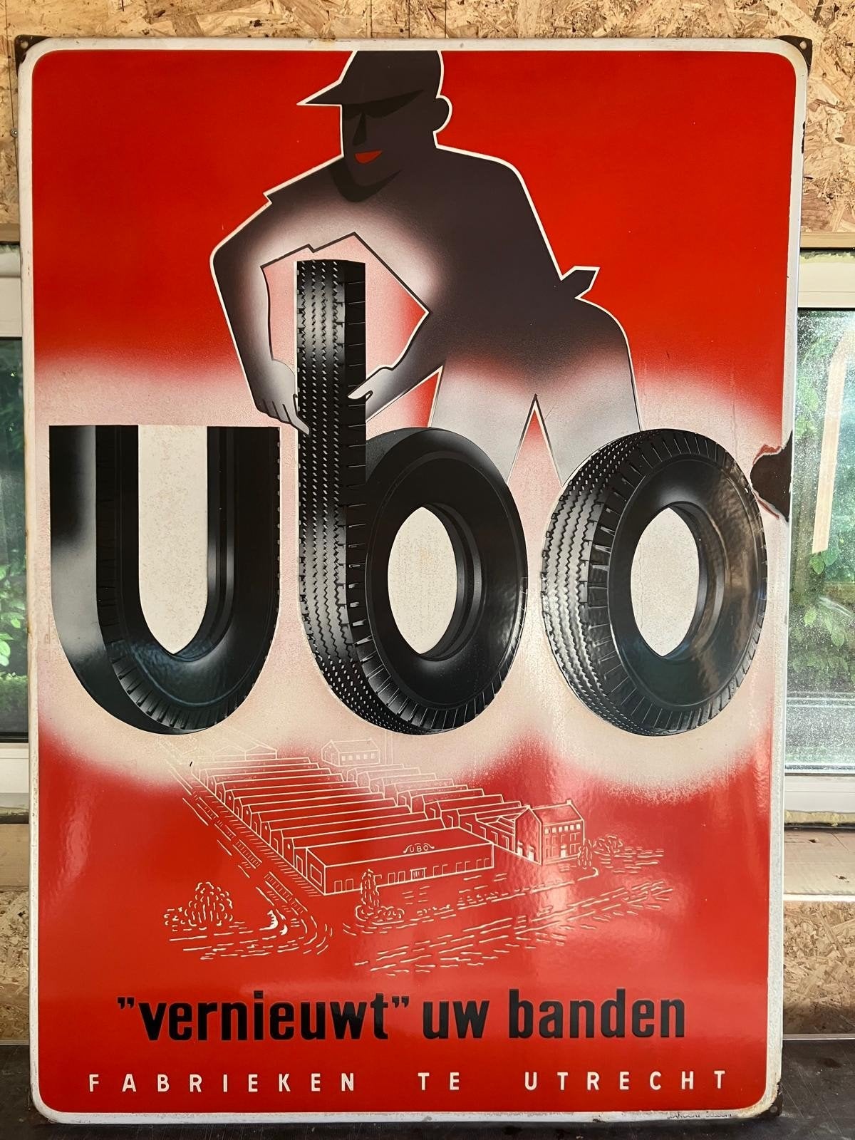 Emaille reclamebord Ubo 'vernieuwt uw banden', Ophalen of Verzenden, Gebruikt
