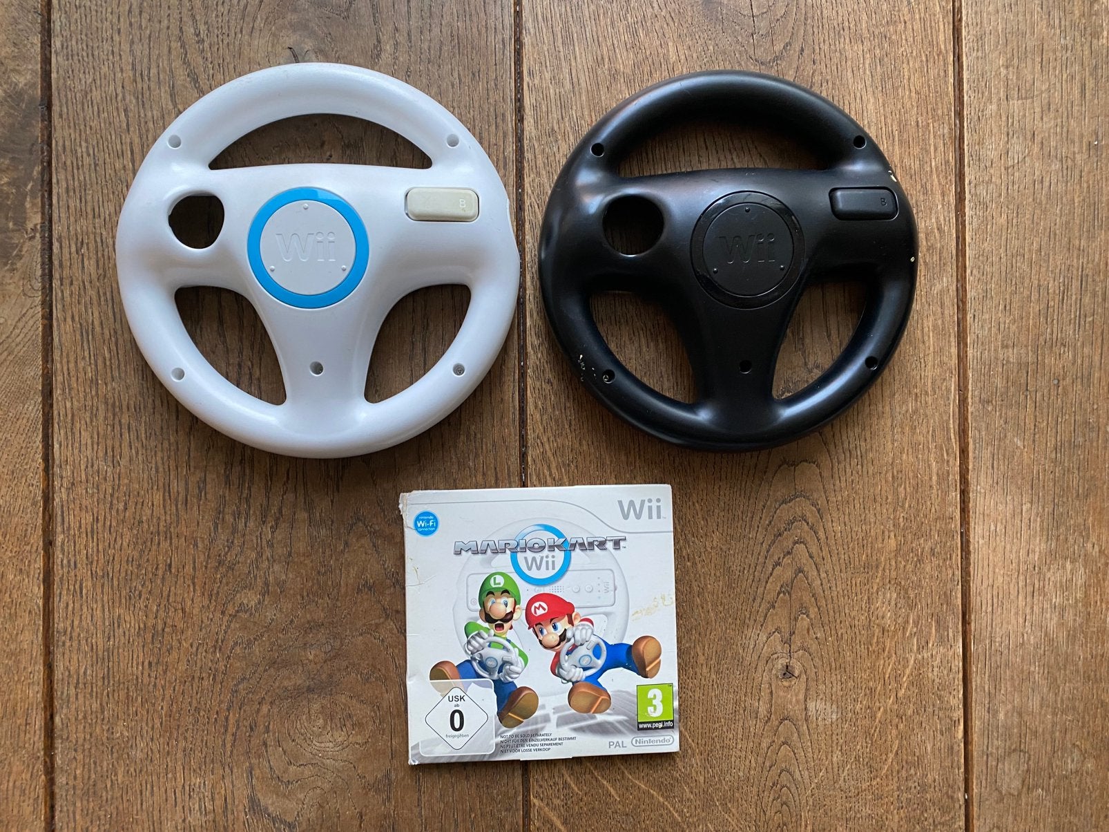Mario Kart Wii + 2 originele stuurtjes, Computers en Software, Ophalen of Verzenden, Zo goed als nieuw