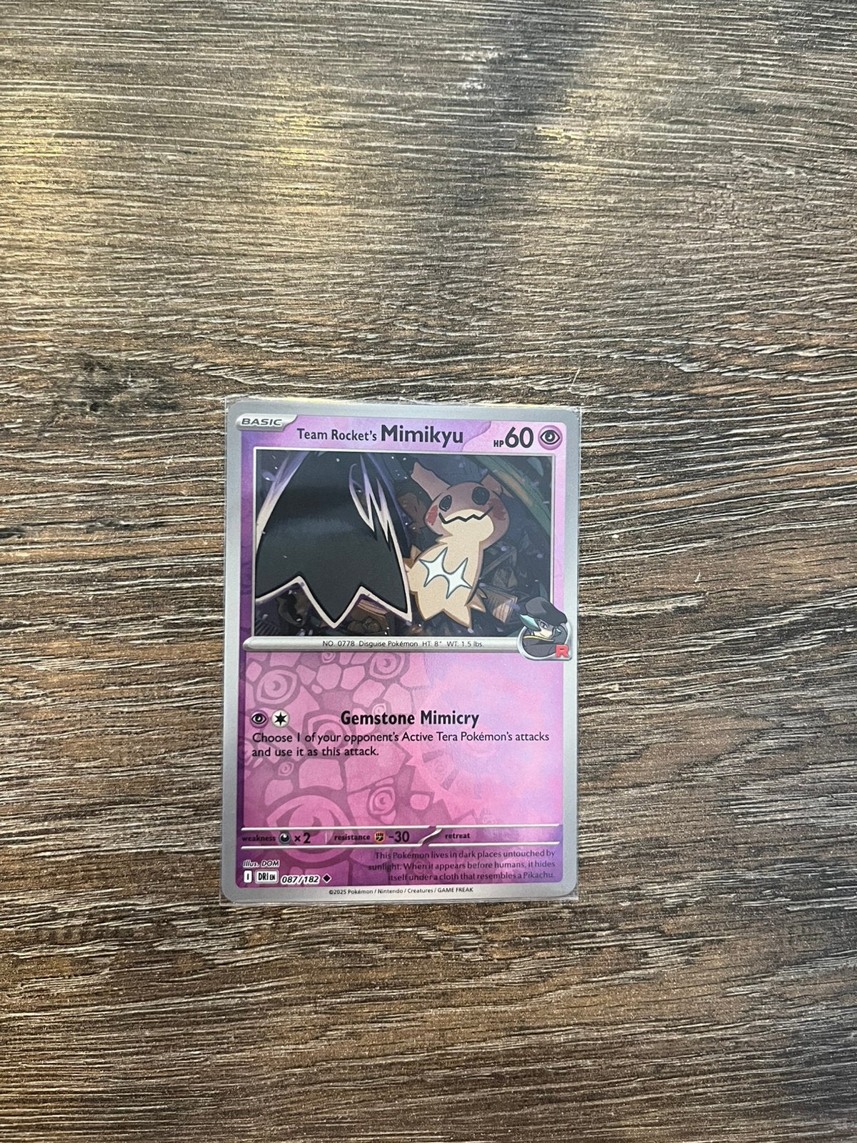 Team Rocket’s Mimikyu DRI 087/182 reverse holo, Ophalen of Verzenden, Zo goed als nieuw