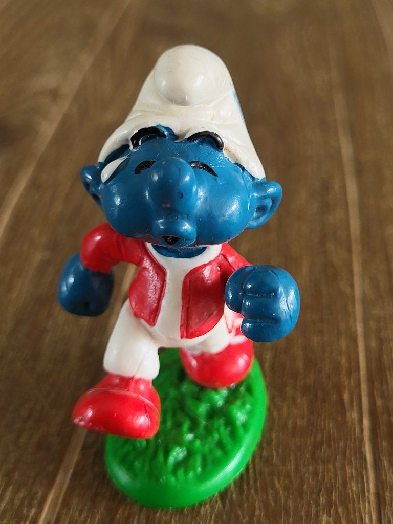 Jogger smurf met gras, Verzamelen, Smurfen, Ophalen of Verzenden, Zo goed als nieuw, Overige Smurfen, Poppetje, Figuurtje of Knuffel