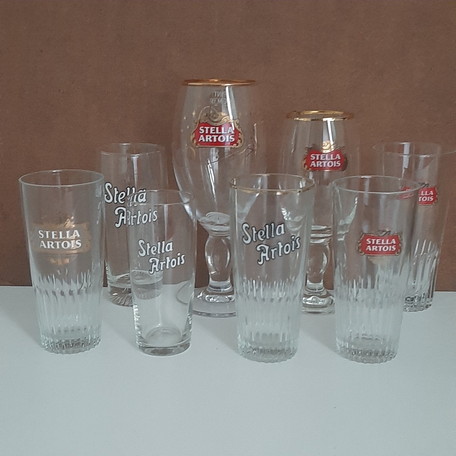 8 Stella Artois bierglazen - Diverse modellen, Verzamelen, Ophalen, Gebruikt