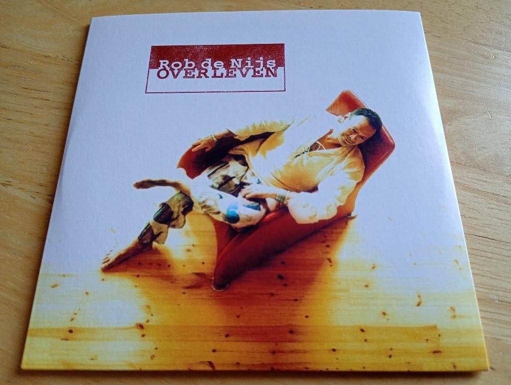 CD Rob de Nijs - Overleven + 5 extra tracks, Verzenden, Zo goed als nieuw, Levenslied of Smartlap