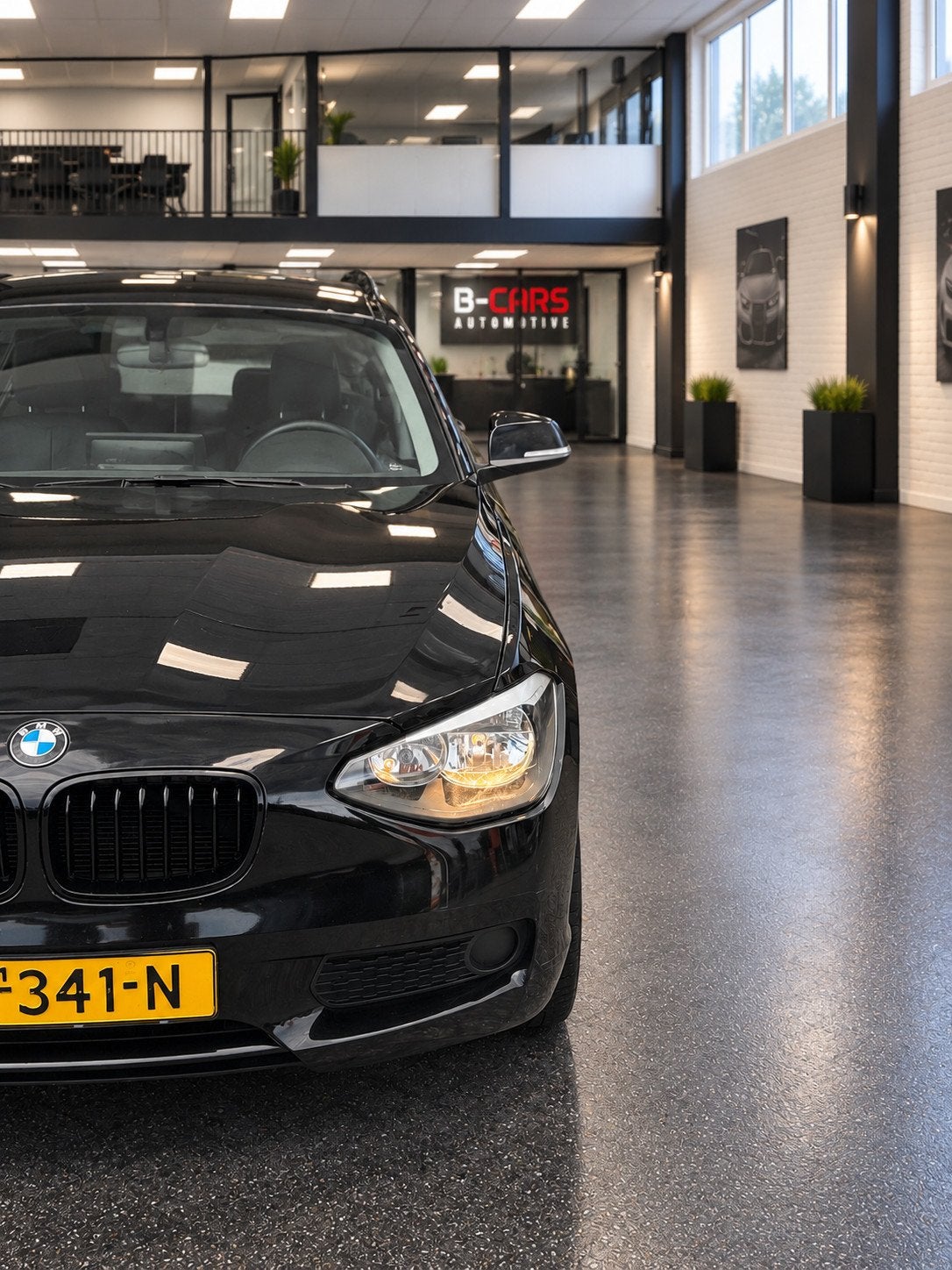 BMW 1-serie 116i Executive Leer|XlNavi|Stoelvw|Pdc|Sport|Nap, Auto's, Gebruikt, 4 cilinders, Zwart, 650 kg