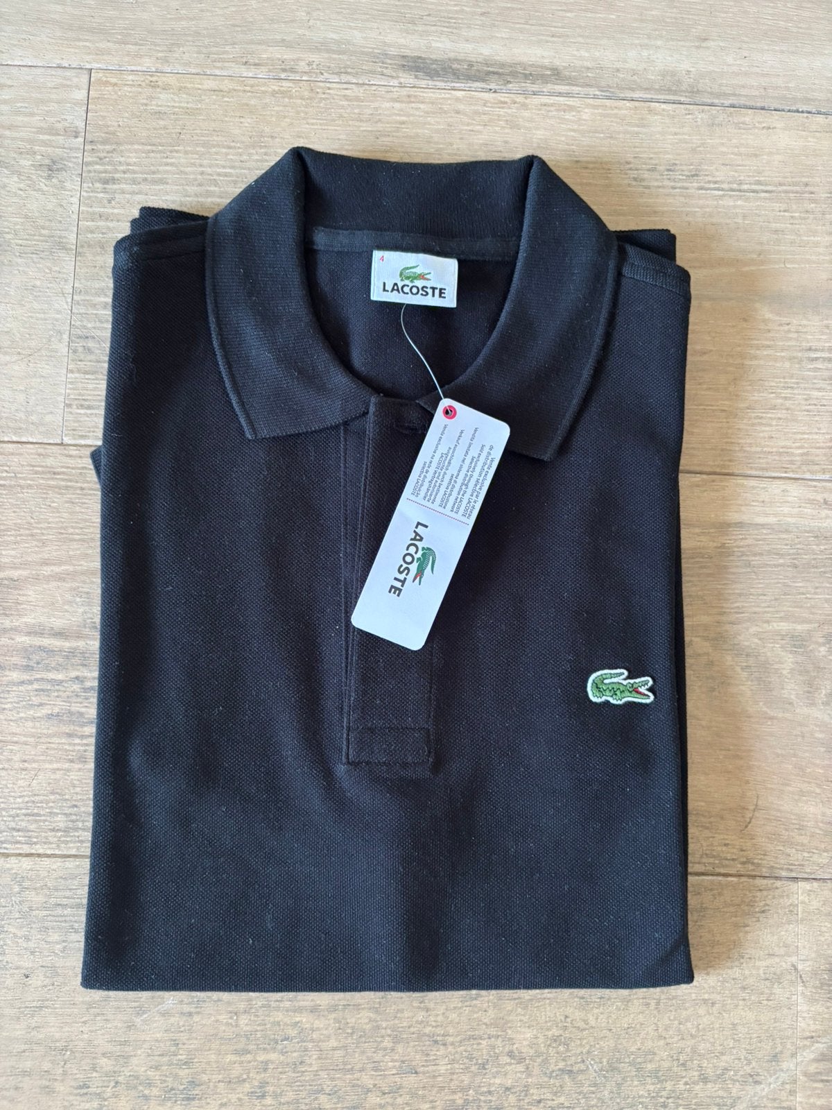 NEW Lacoste Caiman polo 100% cotton blacks size 4 / medium, Kleding | Heren, Polo's, Ophalen of Verzenden, Nieuw, Maat 48/50 (M)
