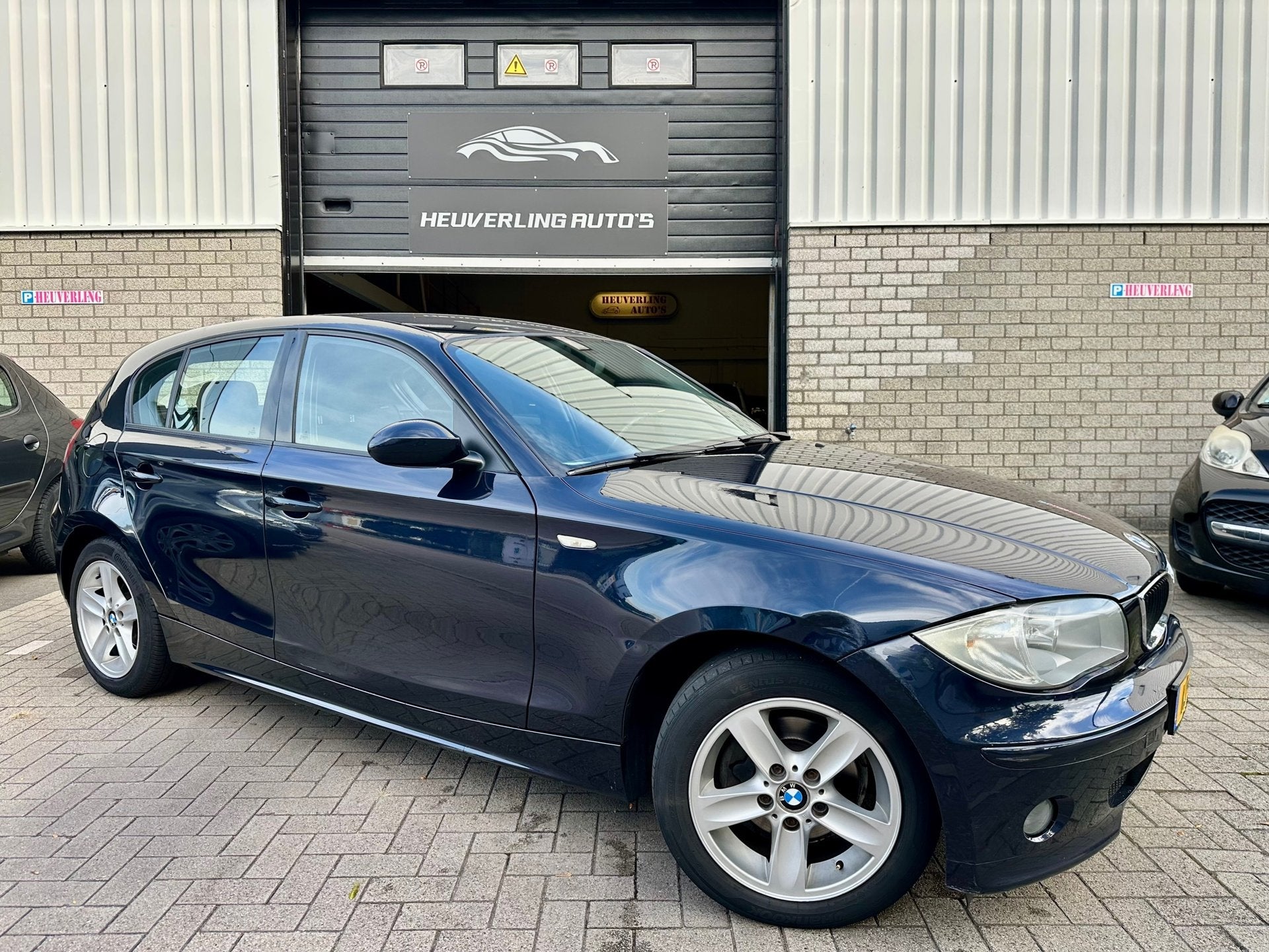 BMW 1-serie 116i | Airco | Stoelverwarming | 5 DRS, Auto's, 1596 cc, Gebruikt, Zwart, 4 cilinders