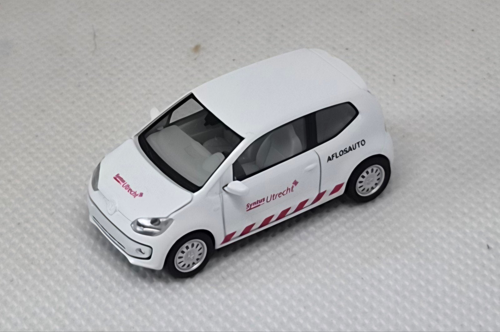 VW UP Syntus Utrecht Aflosauto Eigenbouw, Hobby en Vrije tijd, Ophalen of Verzenden, Zo goed als nieuw, Auto, Herpa