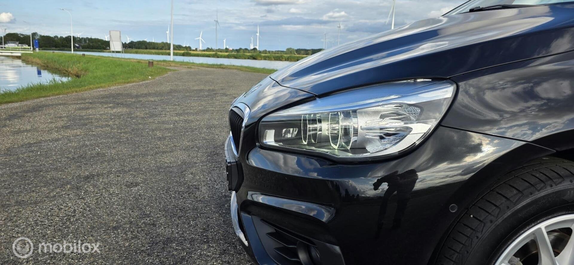 BMW 2-serie Active Tourer 216i High Executive, 97000km A, Auto's, Voorwielaandrijving, Gebruikt, Euro 6, Zwart