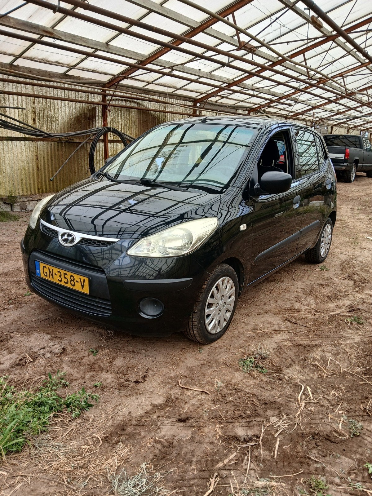 Hyundai i10 1.1 I 5DR 2009 Zwart, Auto's, Voorwielaandrijving, 31 €/maand, 4 cilinders, 400 kg